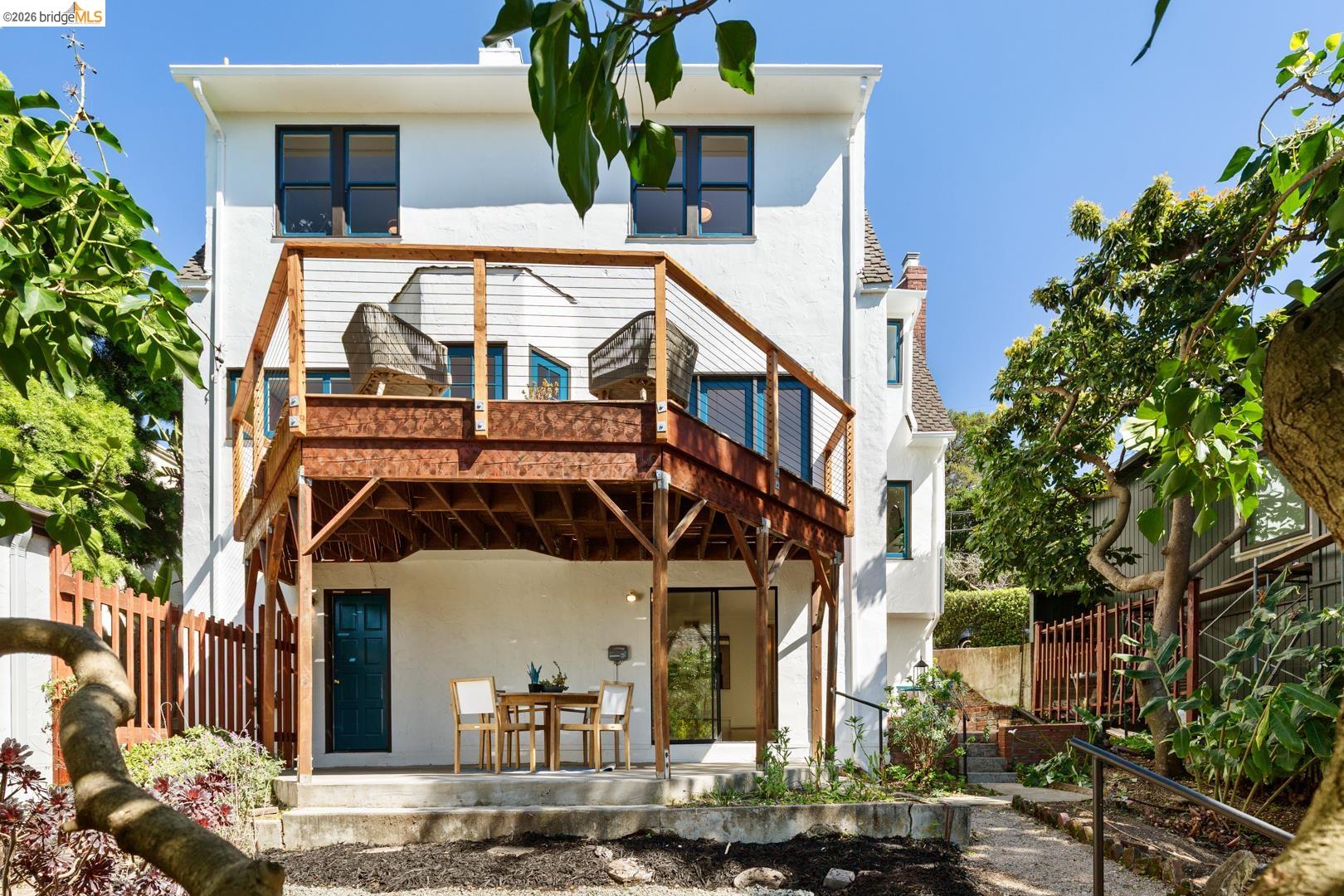 758 Spruce Street Berkeley, CA 94707 - Photo 45 of 60 Back of house with stucco siding, a patio area, and outdoor dining space