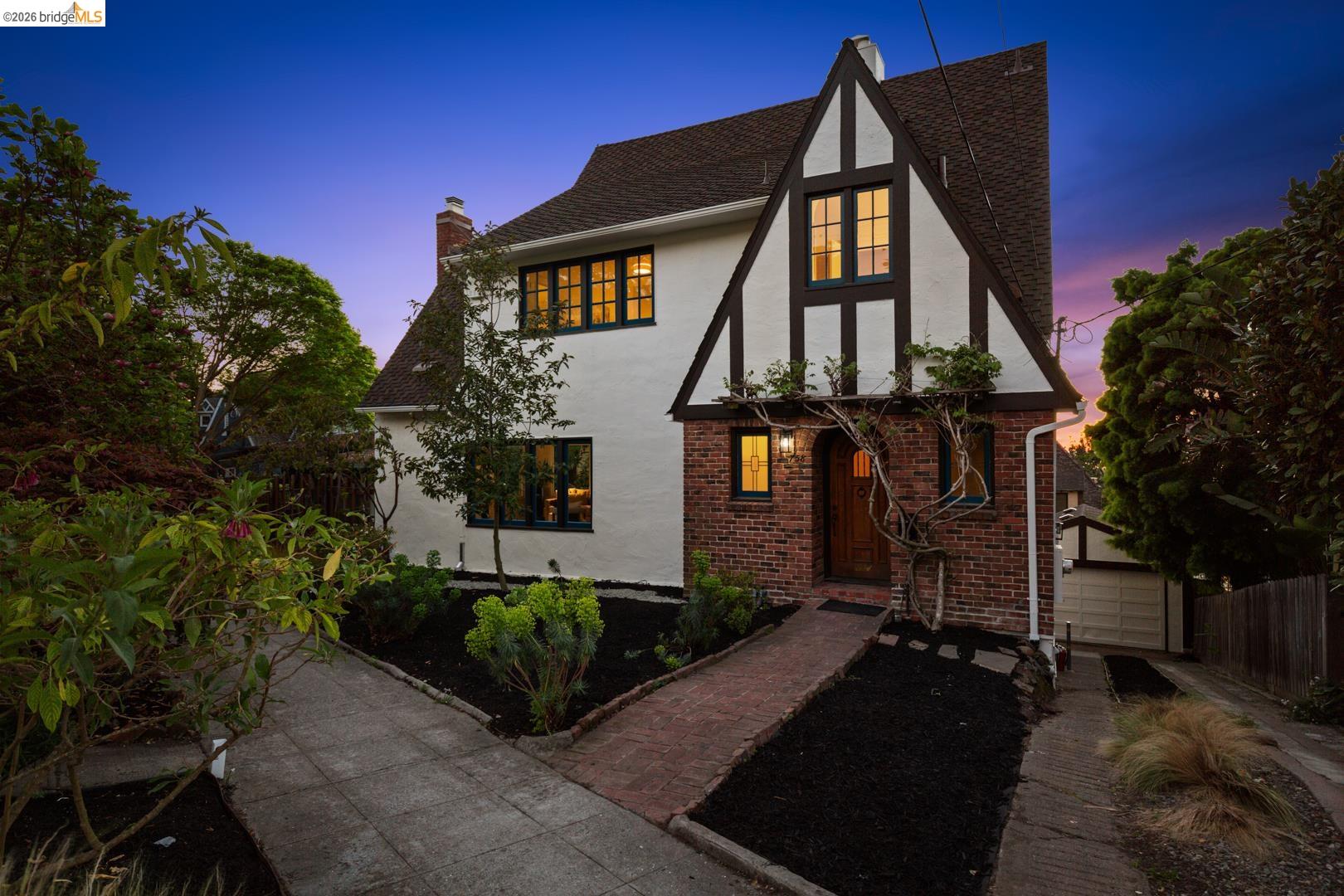 758 Spruce Street Berkeley, CA 94707 - Photo 52 of 60 Tudor-style house with stucco siding, a chimney, brick siding, and roof with shingles