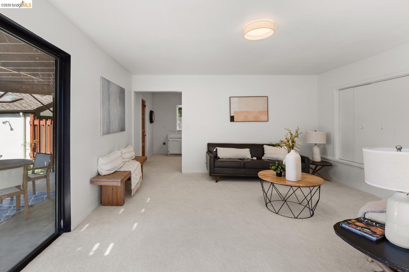758 Spruce Street Berkeley, CA 94707 - Photo 7 of 60 Living area featuring light colored carpet