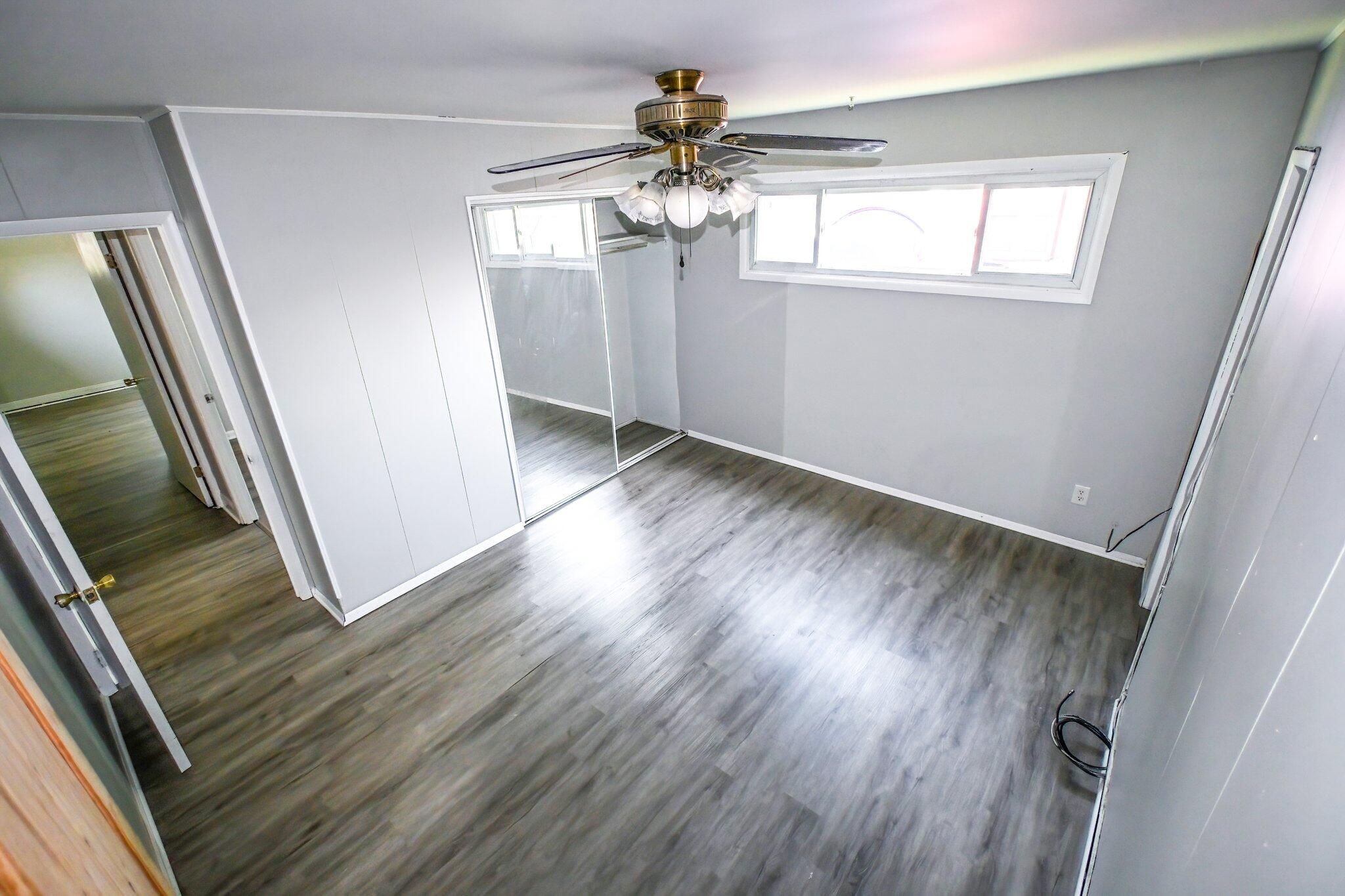 7828 Chestnut Avenue Hammond, IN 46324 - Photo 10 of 23 wooden floor in an empty room with a window
