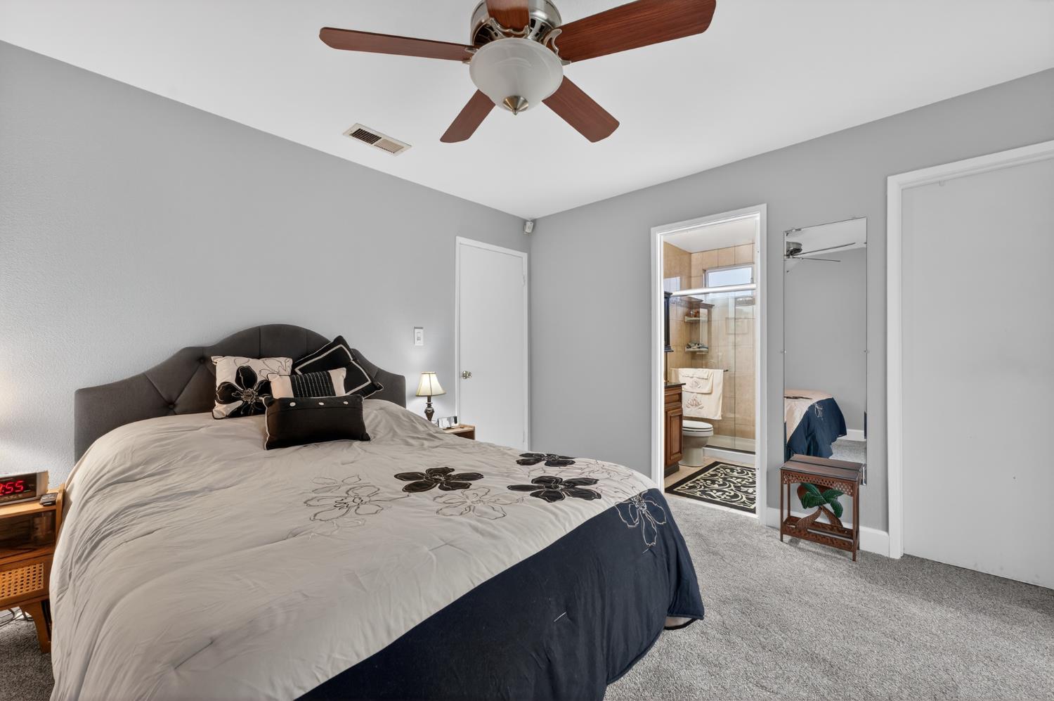 4625 Ruth Way Union City, CA 94587 - Photo 33 of 60 a bedroom with a bed and a chandelier