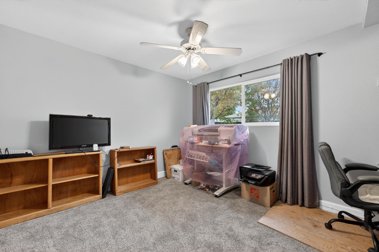 4625 Ruth Way Union City, CA 94587 - Photo 36 of 60 a room with furniture a window and a flat screen tv