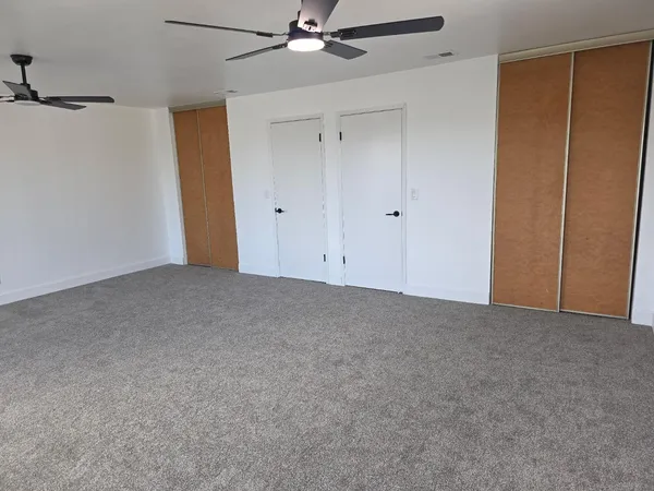 an aerial view of a house with a swimming pool