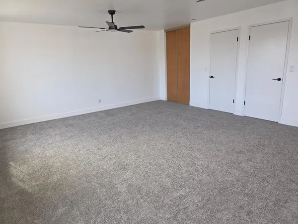 an aerial view of multiple houses with a yard