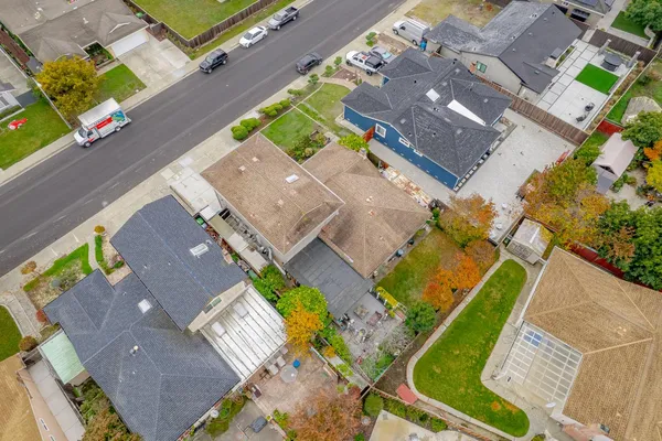 an aerial view of a house with a swimming pool
