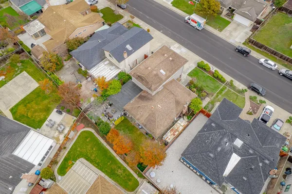 an aerial view of residential building and parking space