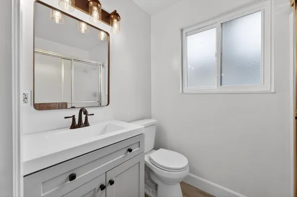 a bathroom with a toilet a sink and a bathtub