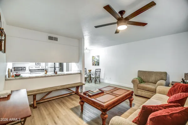 a living room with furniture and a window