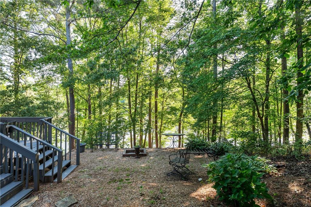 24 Commerce Row Northeast Cartersville, GA 30121 - Photo 33 of 37 a view of backyard with trees