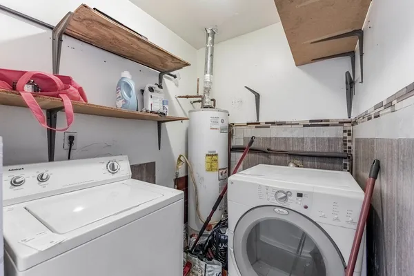 a view of a livingroom with a hardwood floor and a ceiling fan