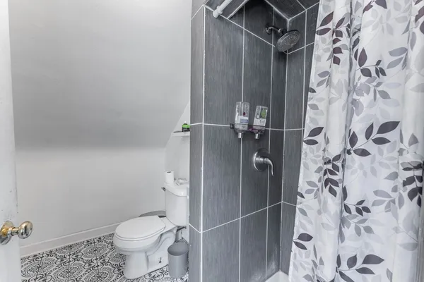 a view of a house with a yard covered in snow