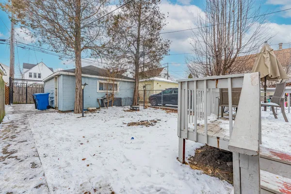 a view of a patio with table and chairs and wooden floor
