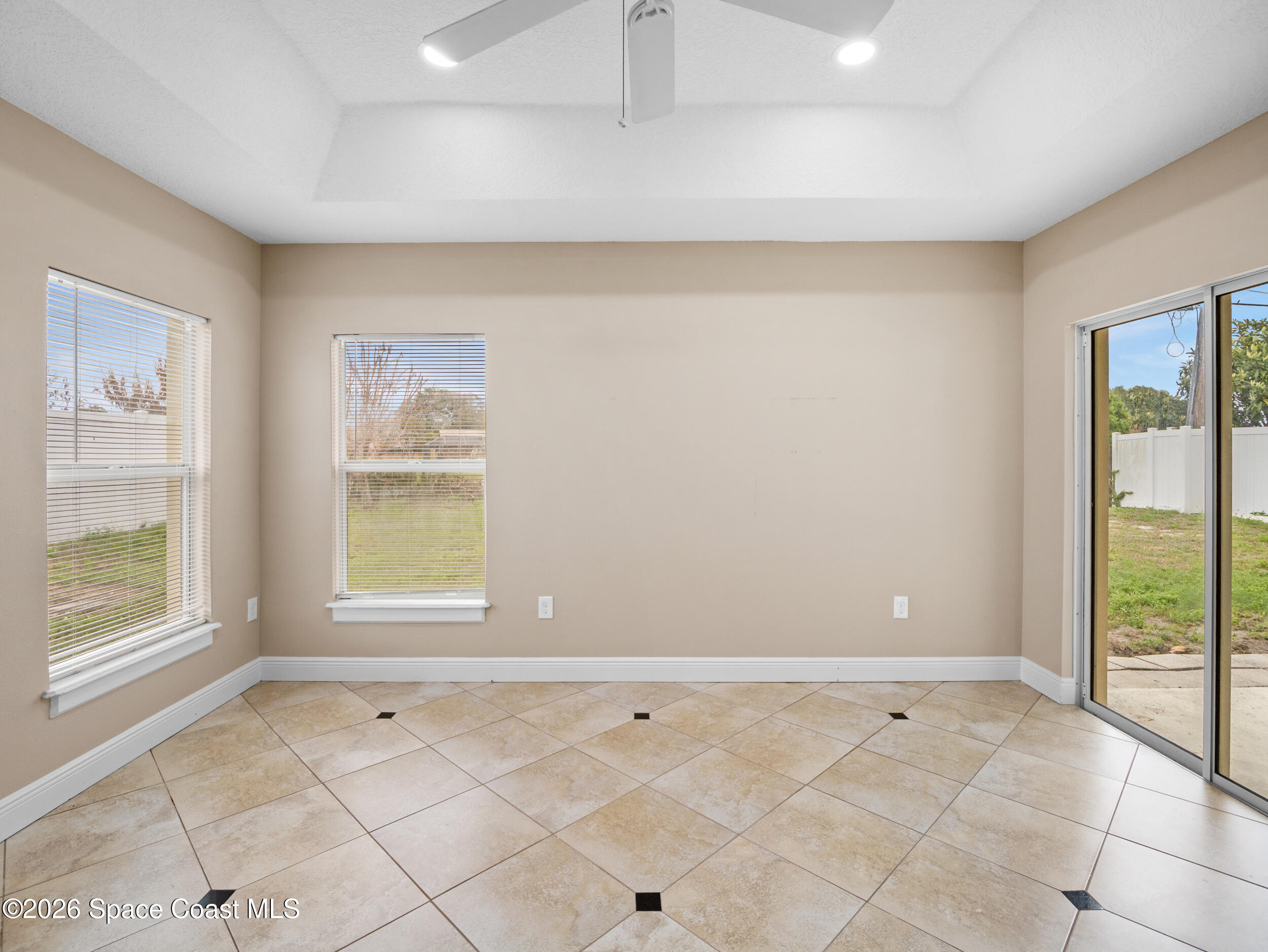 2246 Warwick Road Melbourne, FL 32935 - Photo 13 of 40 a view of an empty room with a window