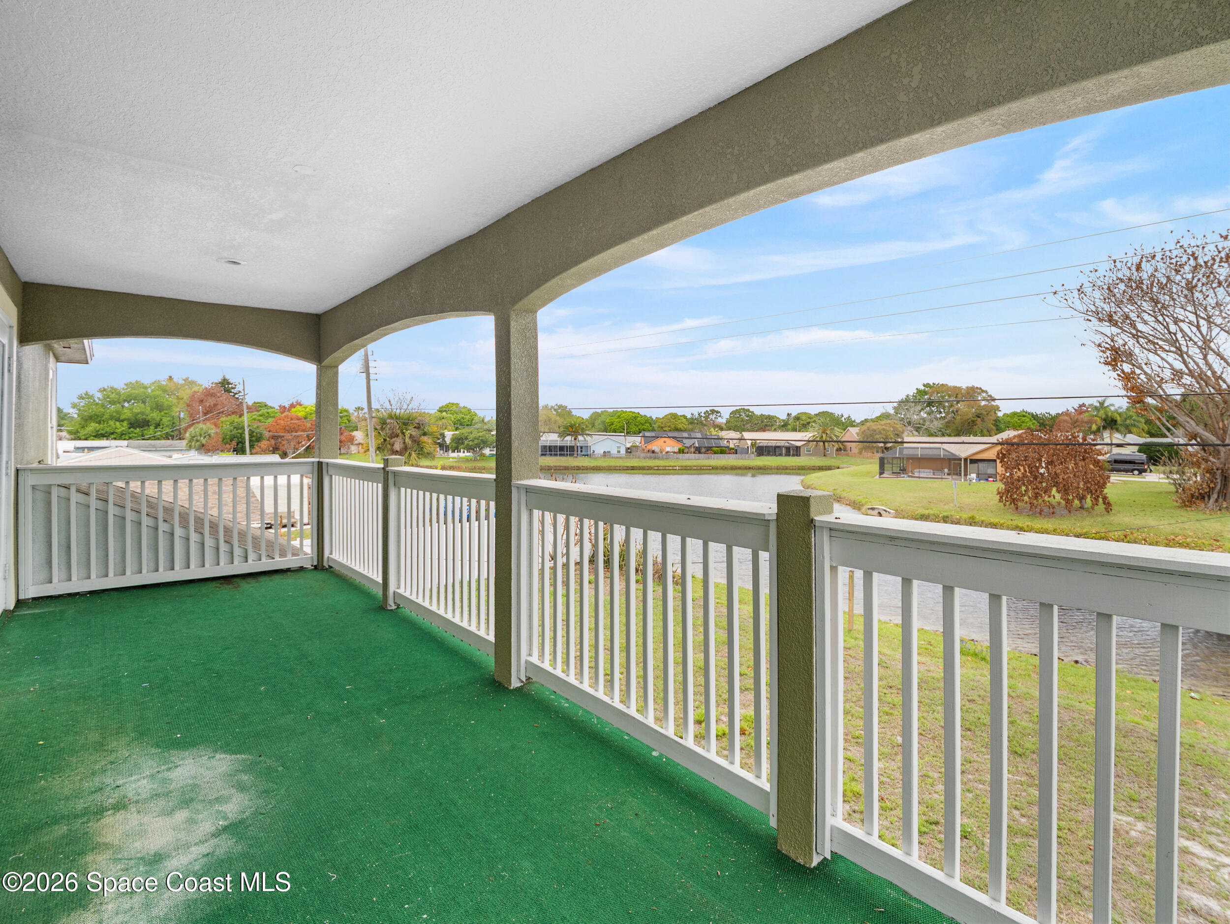 2246 Warwick Road Melbourne, FL 32935 - Photo 20 of 40 a view of a balcony with wooden fence