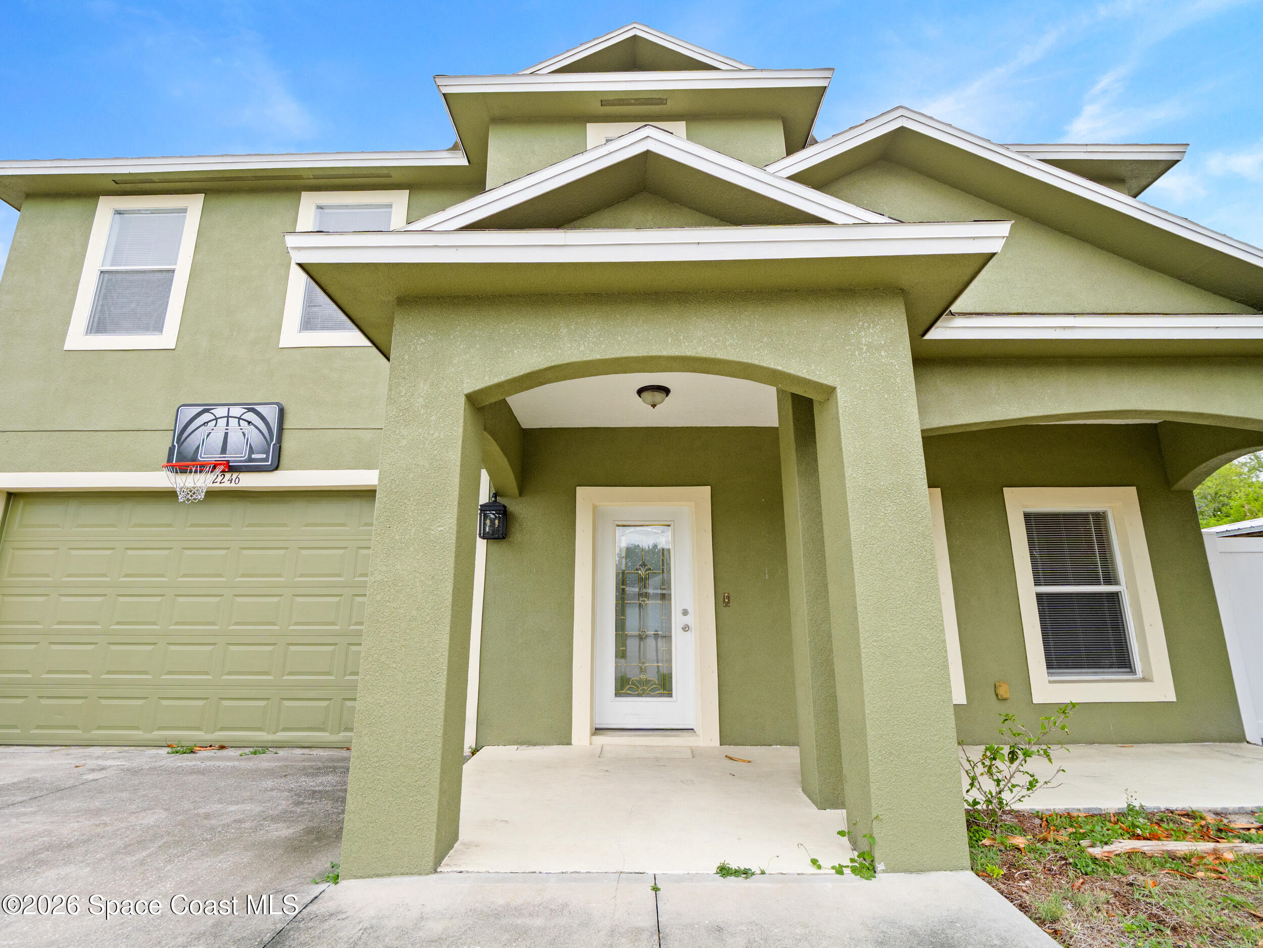 2246 Warwick Road Melbourne, FL 32935 - Photo 3 of 40 a front view of a house