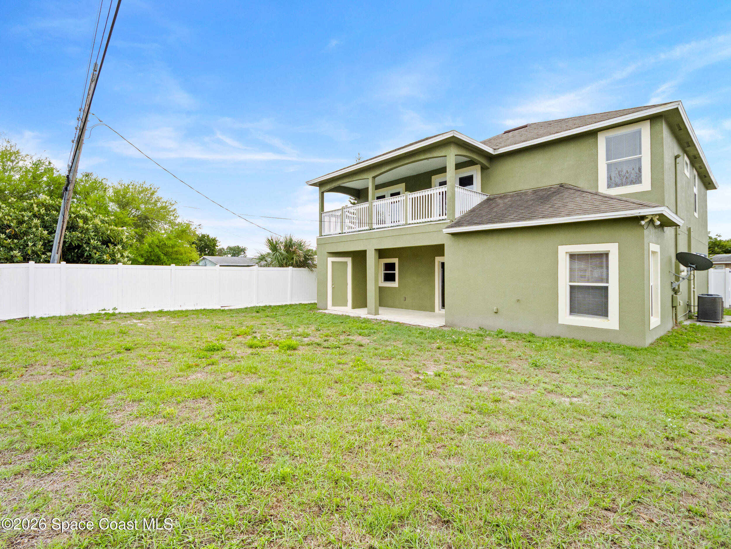 2246 Warwick Road Melbourne, FL 32935 - Photo 31 of 40 a view of a house with a backyard