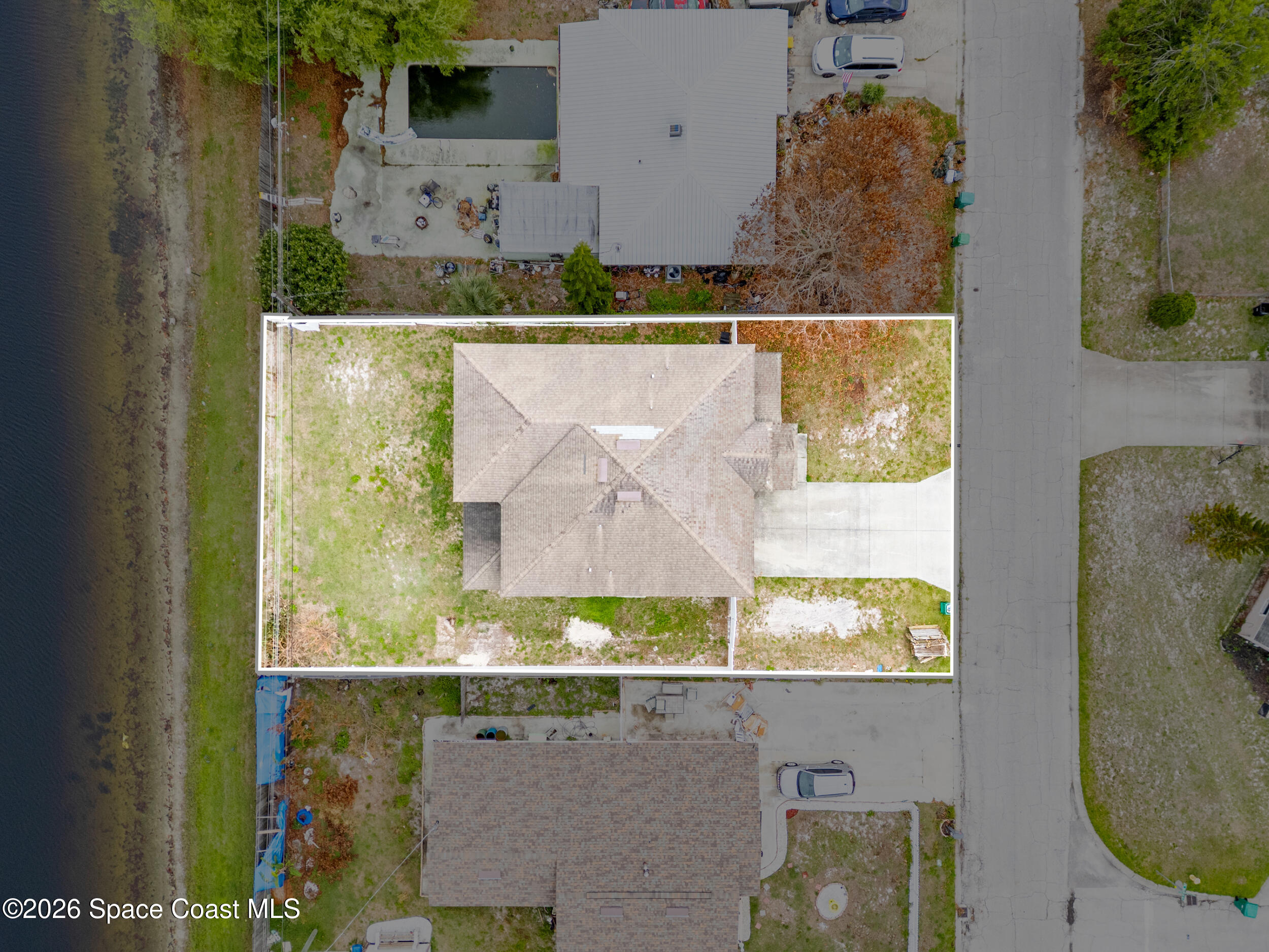 2246 Warwick Road Melbourne, FL 32935 - Photo 38 of 40 an aerial view of a residential houses with outdoor space