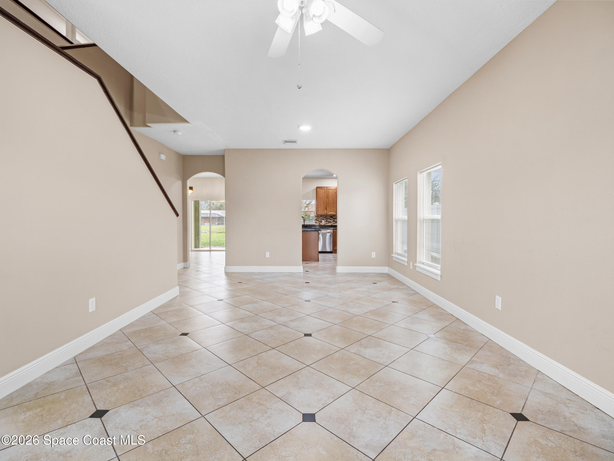 2246 Warwick Road Melbourne, FL 32935 - Photo 5 of 40 a view of empty room with wooden floor