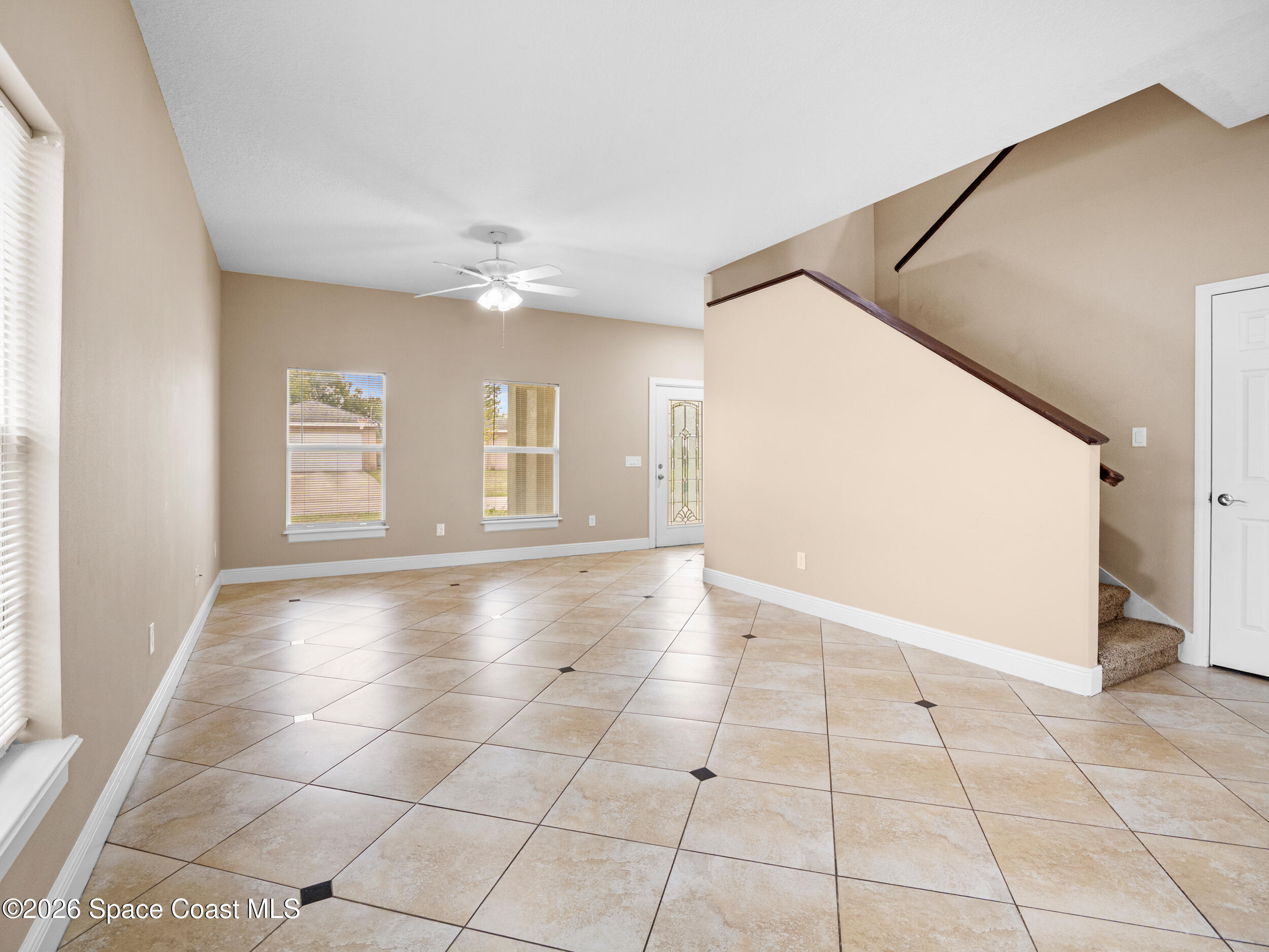 2246 Warwick Road Melbourne, FL 32935 - Photo 6 of 40 a view of an empty room with a window