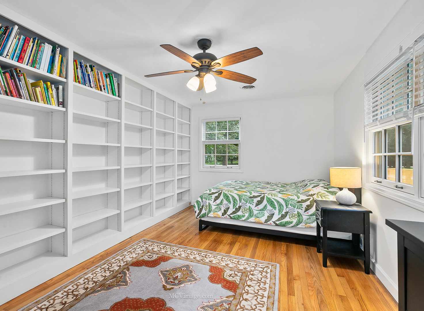 32W501 Derby Road Wayne, IL 60184 - Photo 19 of 28 a living room with a book shelf and a wooden floor
