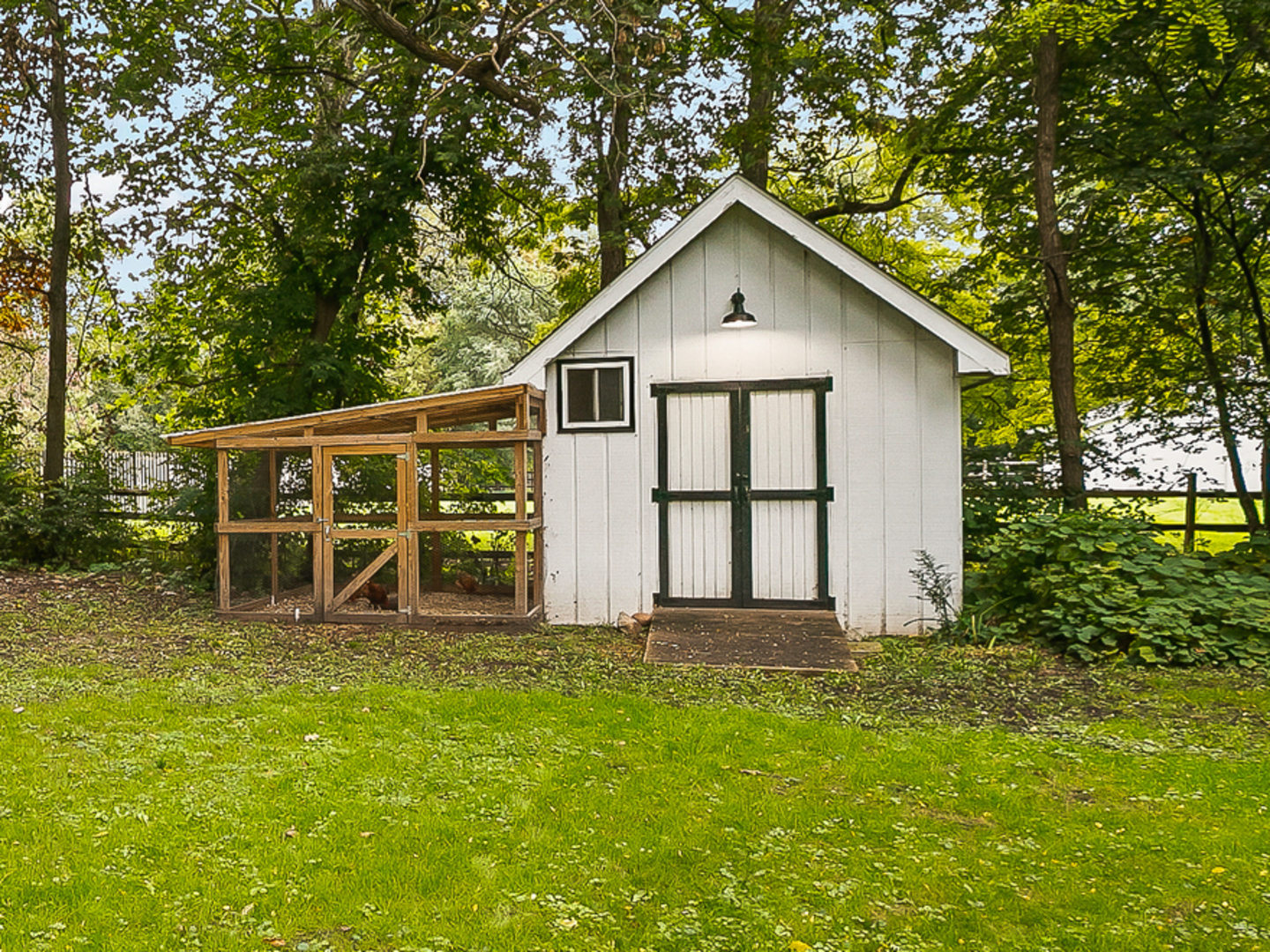 32W501 Derby Road Wayne, IL 60184 - Photo 21 of 28 a backyard of a house with table and chairs
