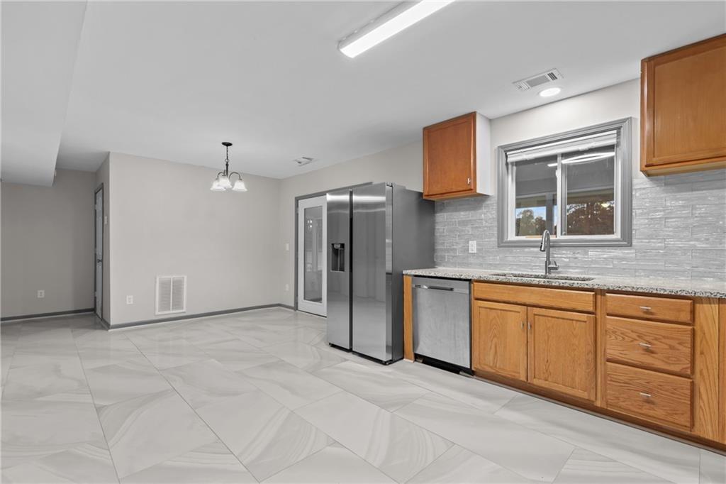 411 Cedar Creek Road Cartersville, GA 30121 - Photo 13 of 58 a view of a kitchen with a sink and a dishwasher