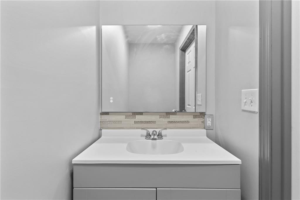 411 Cedar Creek Road Cartersville, GA 30121 - Photo 15 of 58 a bathroom with a sink and a mirror