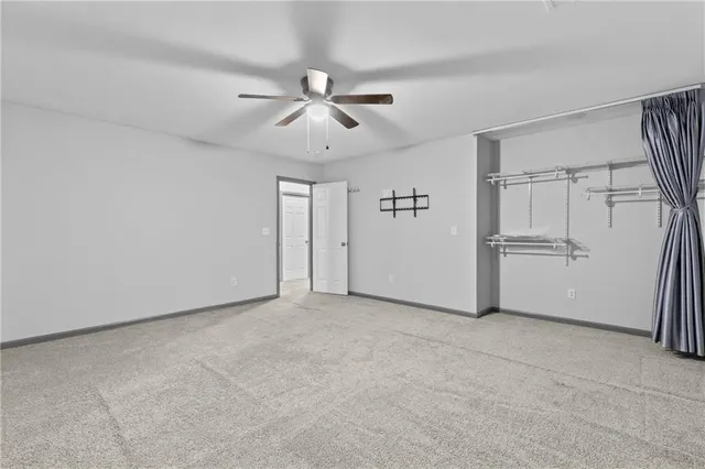 a swimming pool with lawn chairs and plants