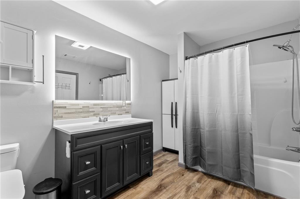 411 Cedar Creek Road Cartersville, GA 30121 - Photo 23 of 58 a bathroom with a granite countertop sink toilet and shower