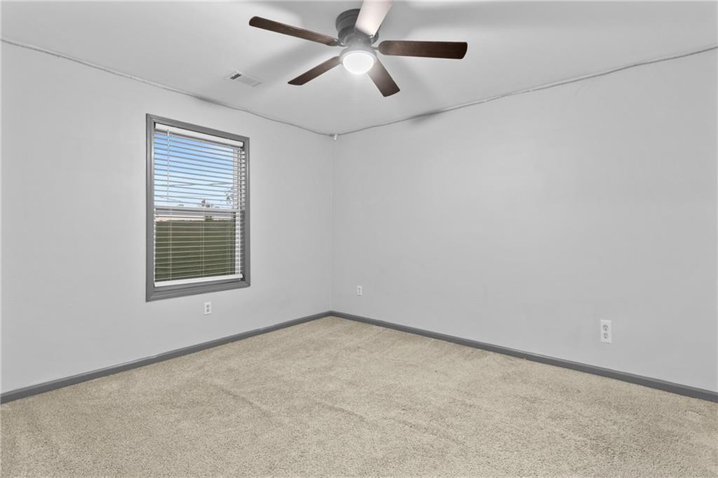 411 Cedar Creek Road Cartersville, GA 30121 - Photo 28 of 58 a view of an empty room with a window