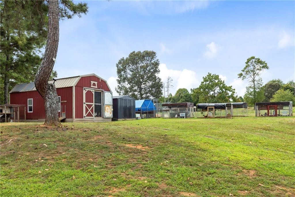 411 Cedar Creek Road Cartersville, GA 30121 - Photo 45 of 58 a front view of a house with a big yard