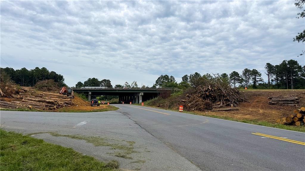 411 Cedar Creek Road Cartersville, GA 30121 - Photo 48 of 58 a view of a swimming pool with an outdoor space and seating area
