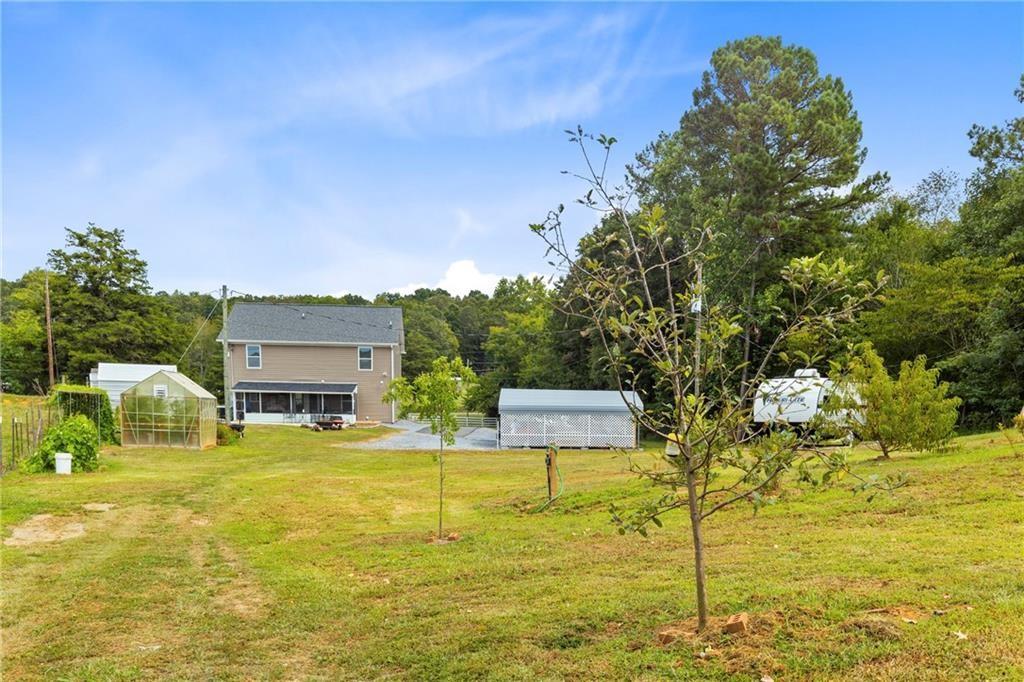 411 Cedar Creek Road Cartersville, GA 30121 - Photo 49 of 58 a swimming pool with lawn chairs and plants