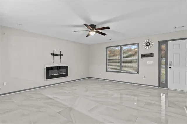 a kitchen with granite countertop cabinets stainless steel appliances and a counter space