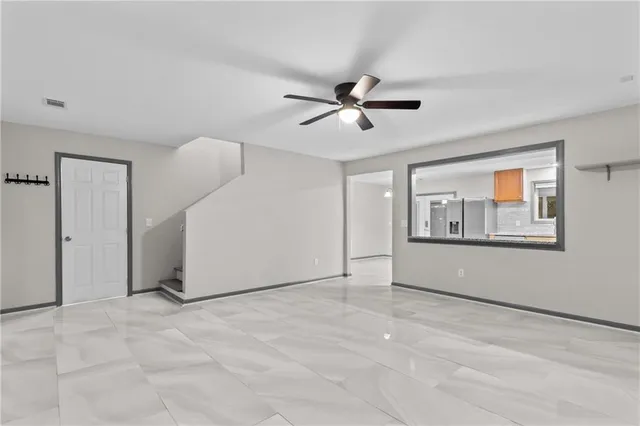 a view of a kitchen with a sink and a dishwasher