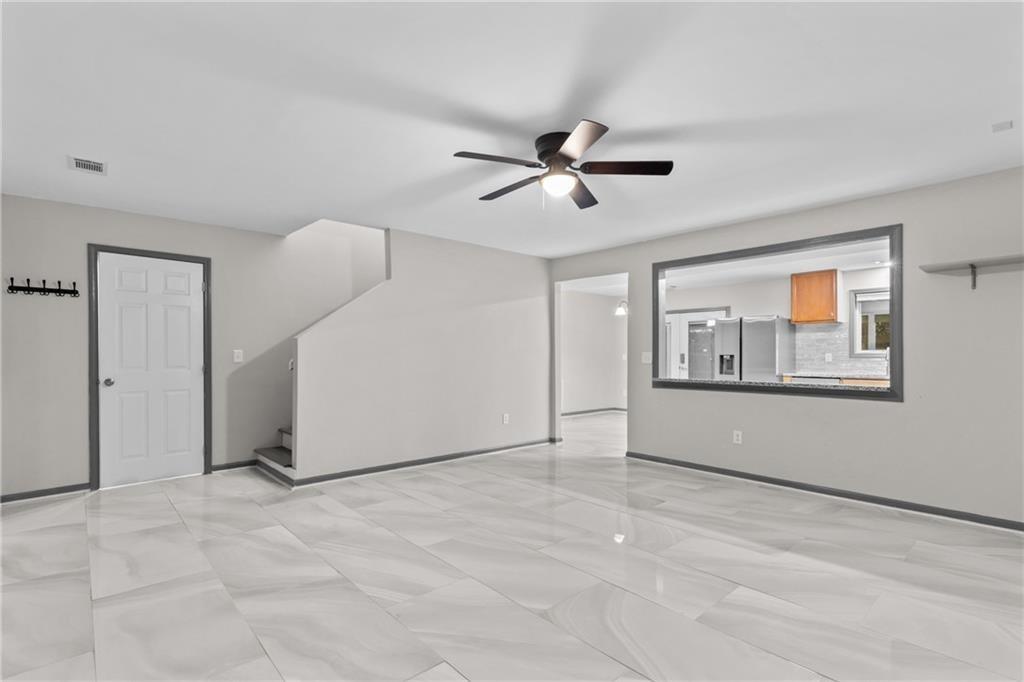 411 Cedar Creek Road Cartersville, GA 30121 - Photo 9 of 58 a view of an empty room with window