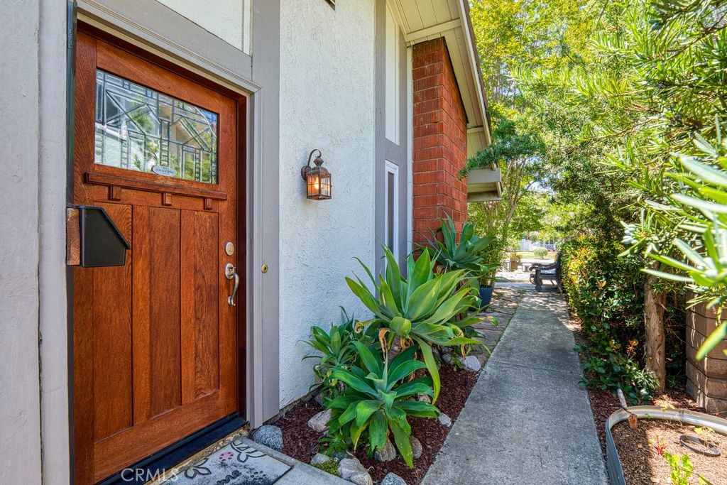 25495 Morningstar Road Lake Forest, CA 92630 - Photo 1 of 31 a potted plant sitting in front of a door