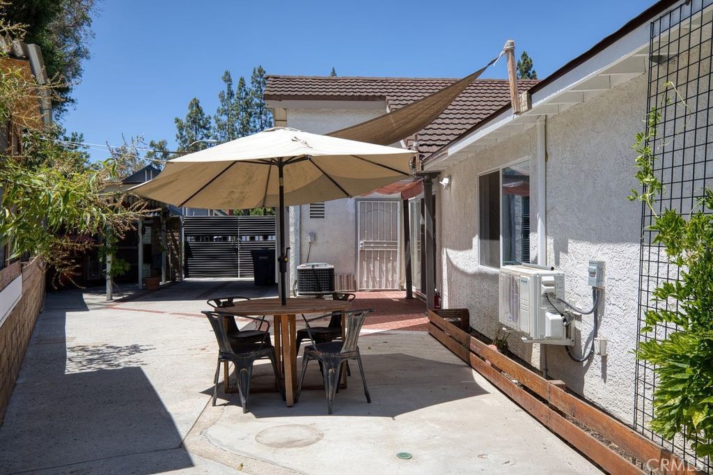 25495 Morningstar Road Lake Forest, CA 92630 - Photo 12 of 31 a view of a patio with table and chairs under an umbrella