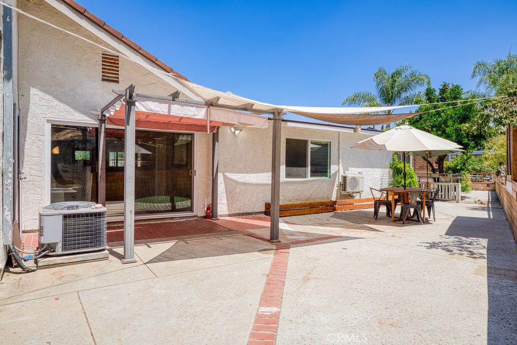 25495 Morningstar Road Lake Forest, CA 92630 - Photo 13 of 31 a view of a patio with a table and chairs under an umbrella