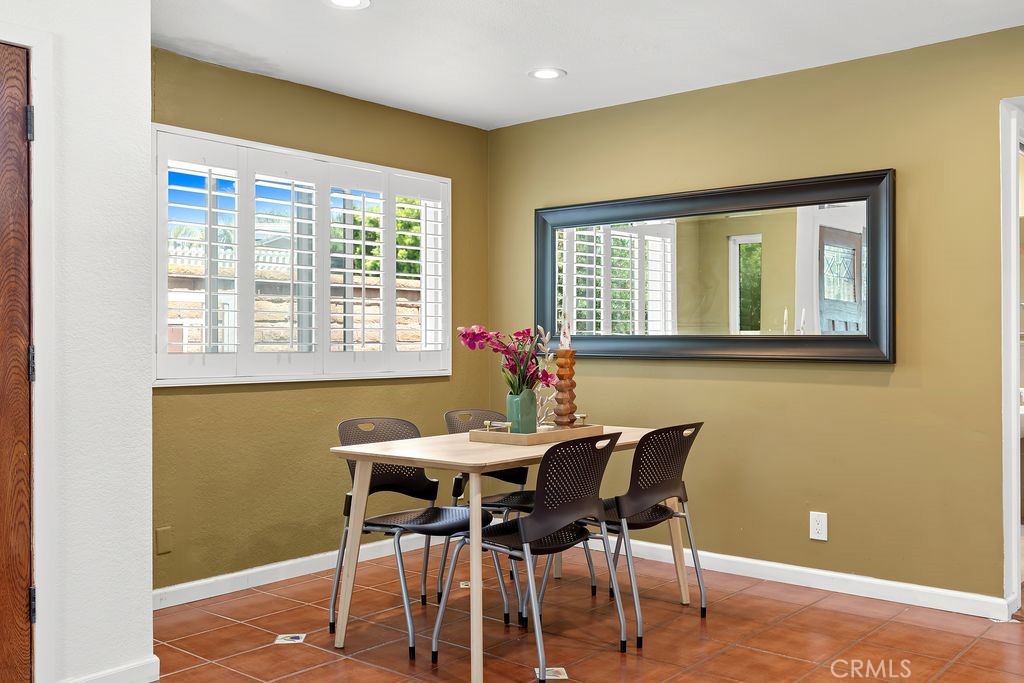 25495 Morningstar Road Lake Forest, CA 92630 - Photo 18 of 31 a dining room with a window and wooden floor