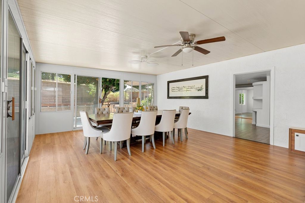 25495 Morningstar Road Lake Forest, CA 92630 - Photo 22 of 31 a view of a dining room with furniture window and wooden floor