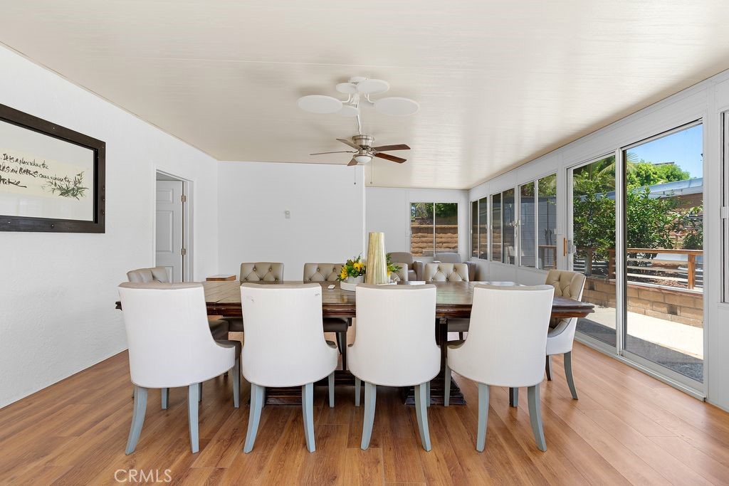 25495 Morningstar Road Lake Forest, CA 92630 - Photo 23 of 31 a view of a dining room with furniture wooden floor and chandelier