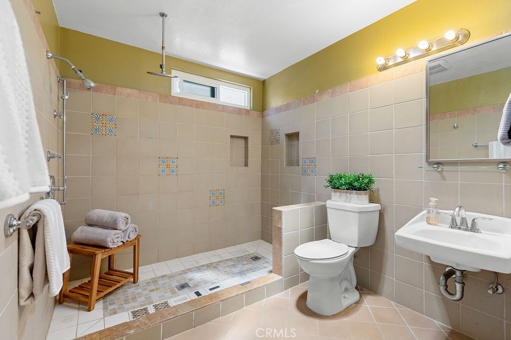 25495 Morningstar Road Lake Forest, CA 92630 - Photo 27 of 31 a bathroom with a toilet sink and mirror