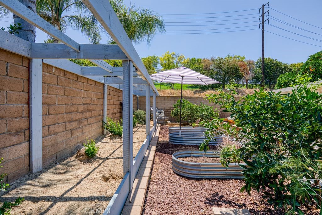 25495 Morningstar Road Lake Forest, CA 92630 - Photo 10 of 31 a view of a patio with table and chairs potted plants