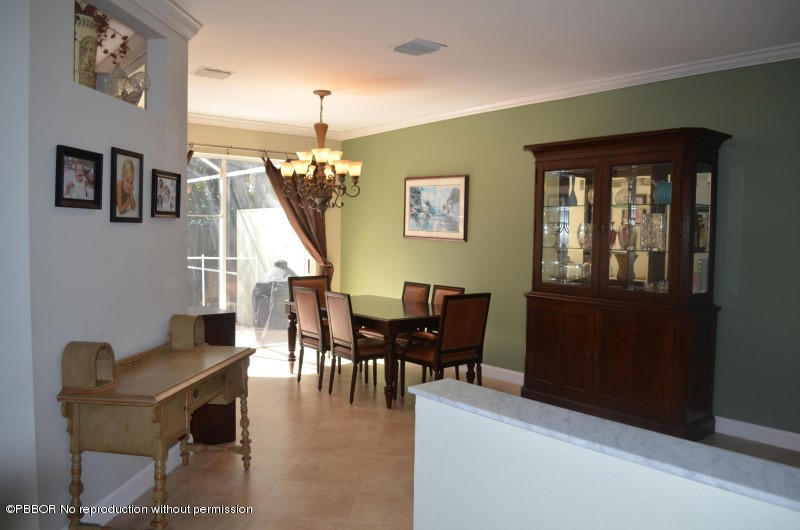9506 Fox Trot Lane Boca Raton, FL 33496 - Photo 2 of 26 a view of a livingroom with furniture stairs and bedroom
