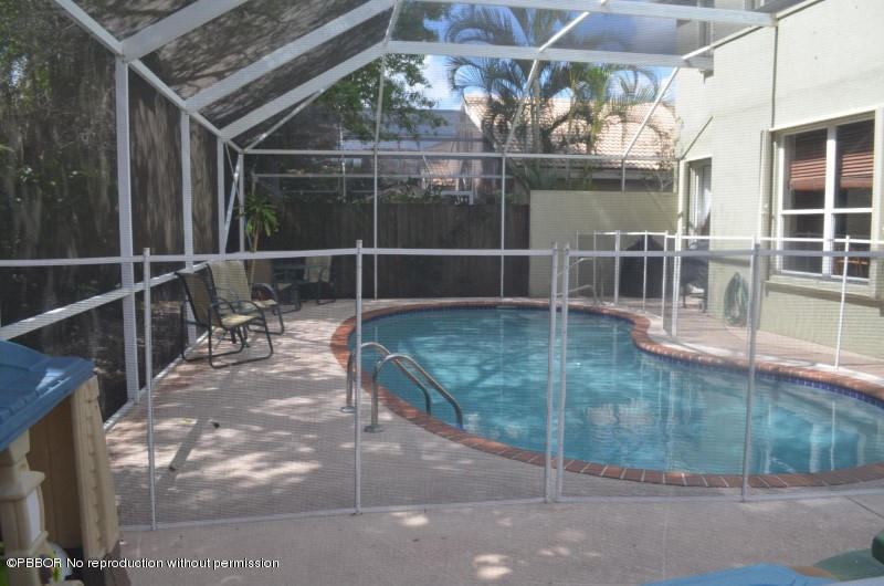 9506 Fox Trot Lane Boca Raton, FL 33496 - Photo 11 of 26 a view of a glass door with glass door and deck