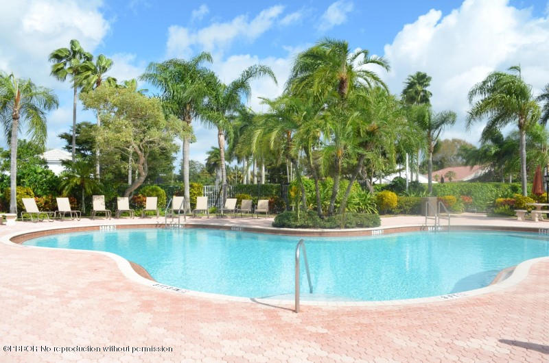 9506 Fox Trot Lane Boca Raton, FL 33496 - Photo 22 of 26 a view of a swimming pool and a chair