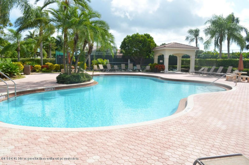 9506 Fox Trot Lane Boca Raton, FL 33496 - Photo 23 of 26 a view of a house with pool plants and palm trees