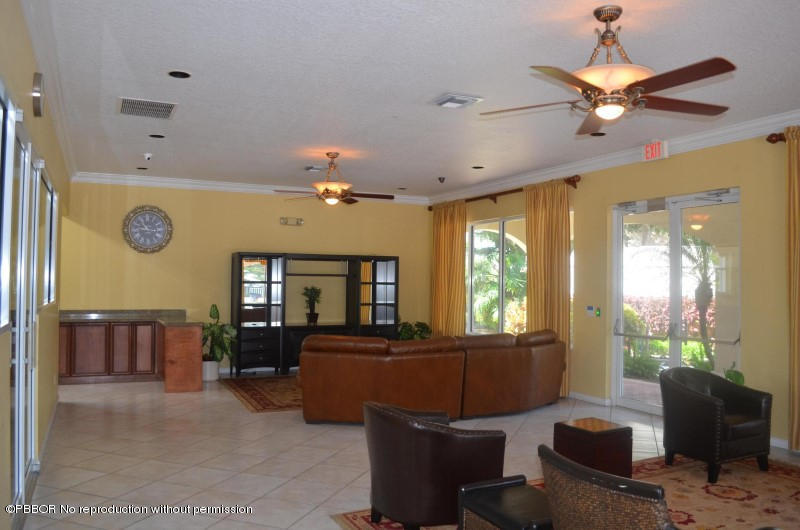 9506 Fox Trot Lane Boca Raton, FL 33496 - Photo 25 of 26 a living room with furniture and a large window