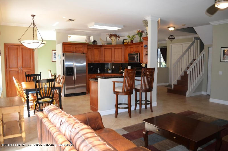 9506 Fox Trot Lane Boca Raton, FL 33496 - Photo 6 of 26 a living room with lots of furniture and kitchen view